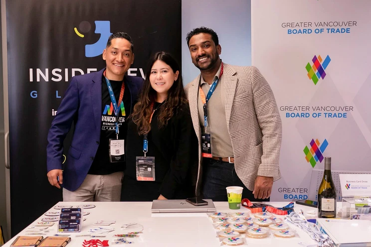 Vancouver Microsoft 365 Summit sponsors and attendees at a networking booth